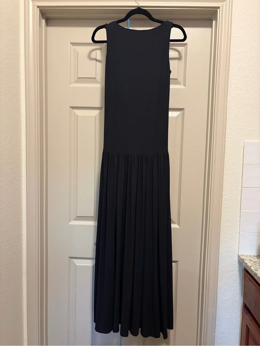 Sleeveless Low Black Maxi Dress with Pleated Skirt